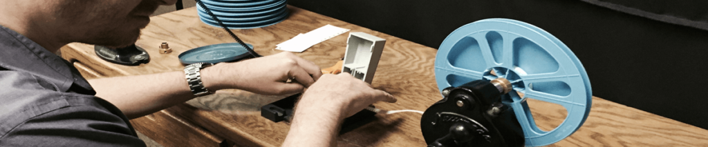 An image showing the process of 8mm film to digital conversion by a professional film conversion service provider.