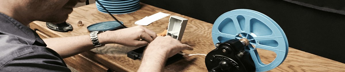 An image showing the process of 8mm film to digital conversion by a professional film conversion service provider.
